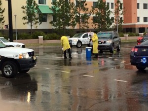 A crew from Environmental Health and Safety worked to clean up a substance in the street. 