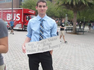 Students held up signs against guns on campus. (Photo: College Democrats).