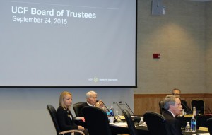 Board members listen to presentations at the Board of Directors meeting.  From left to right: Cait Zona, UCF President John Hitt, Keith Koons (forward) and Board Chairman Marcos Marchena (back right). (Photo by Zachary Ehly)