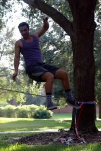 Matt Morin working on slacklining tricks at UCF main campus. Photo by Chelsea Santiago.