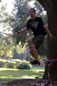 Alec Jacob walking the line during a slacklining session. Photo by Chelsea Santiago.